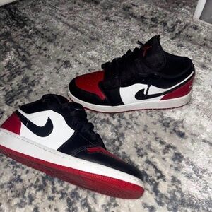 Black and Red Jordan 1s with White Accents